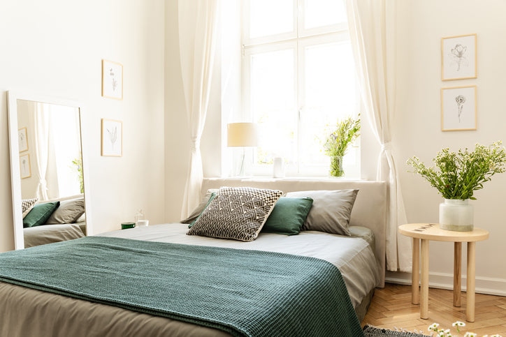 Fresh sheets on bed in bedroom.