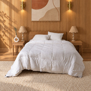 All Seasons 3-in-1 quilt on a bed