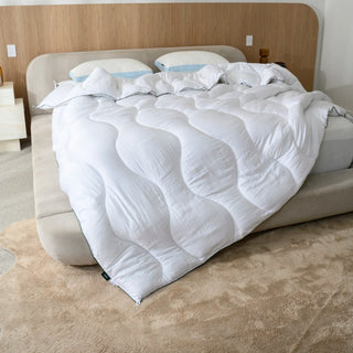 Cloud quilt on a bed