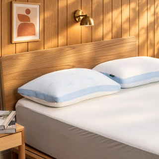 Flip cooling pillows on a bed