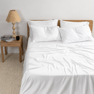 Fur-friendly Bamboo Flat Sheet in White, on a made bed