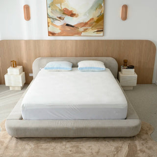 Bamboo mattress protector on a made bed