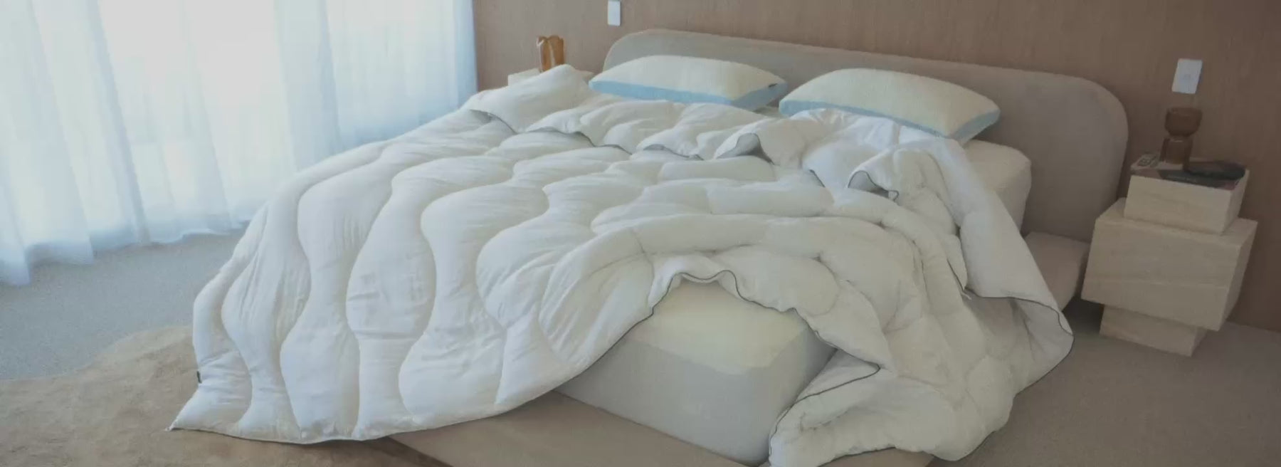 Cloud Quilt and cooling pillows on a made bed